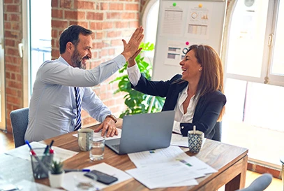 coworkers giving each other a high-five